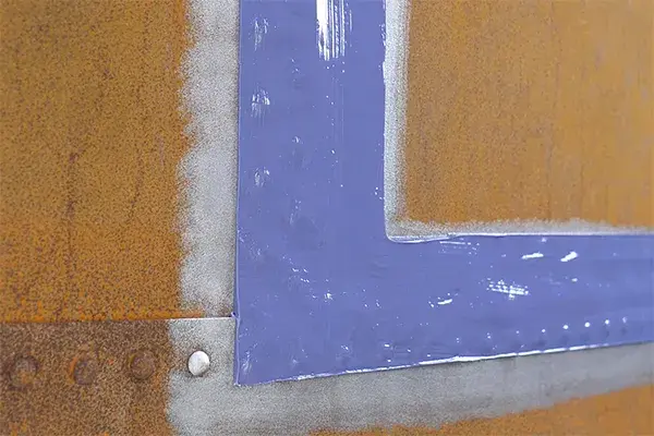 fluid leak from riveted seam of tank plates repaired with Belzona paste